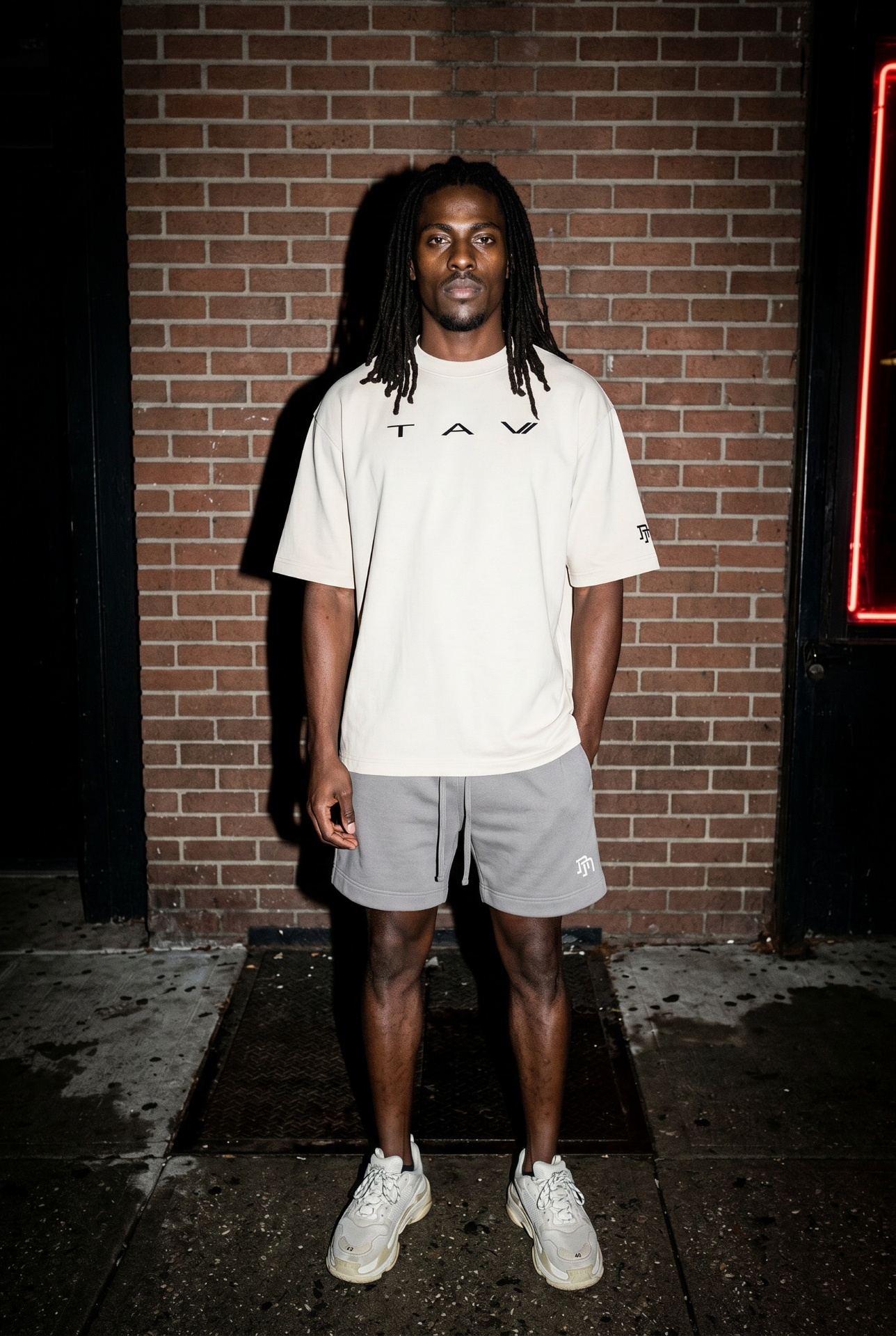 TAV Edition 001 — model wearing oversized hoodie and trousers